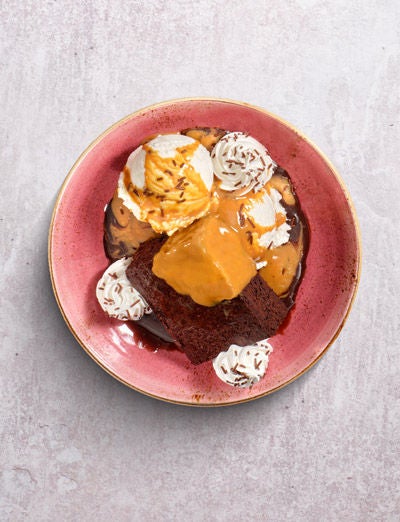 a plate of food with ice cream and brownies