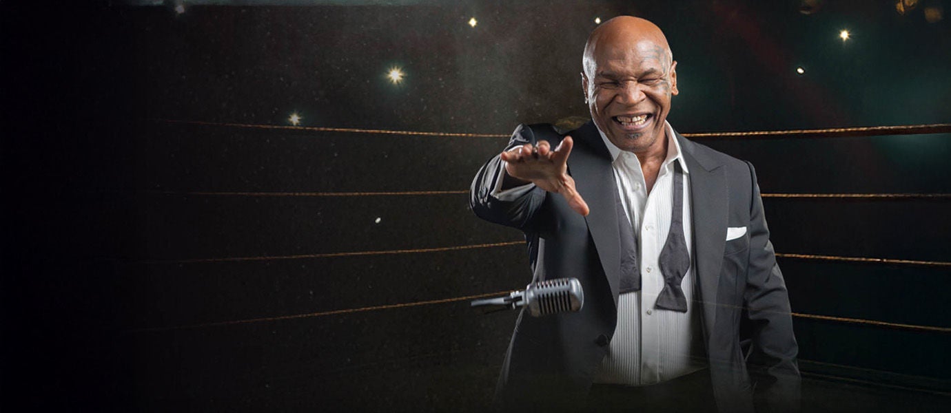 Mike Tyson in ring dropping a mic