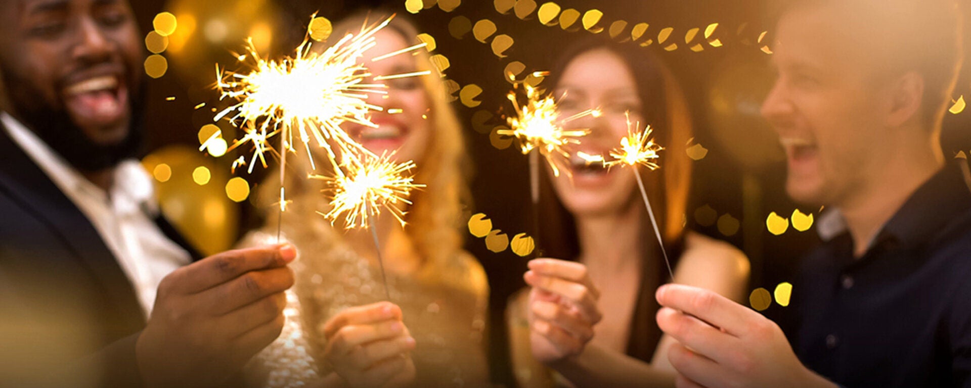 a group of women holding sparklers